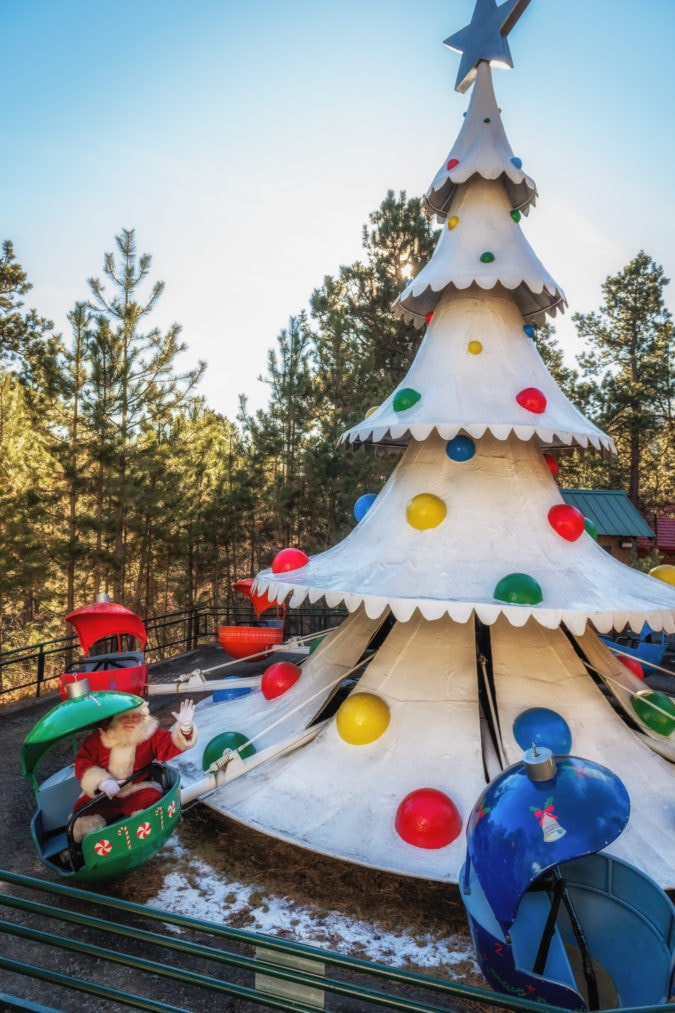 Santa takes a turn on the Christmas Tree Ride.